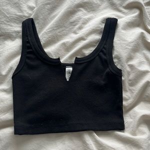 Black top with a v cut out